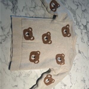Matching boys bear sweaters and checked pants